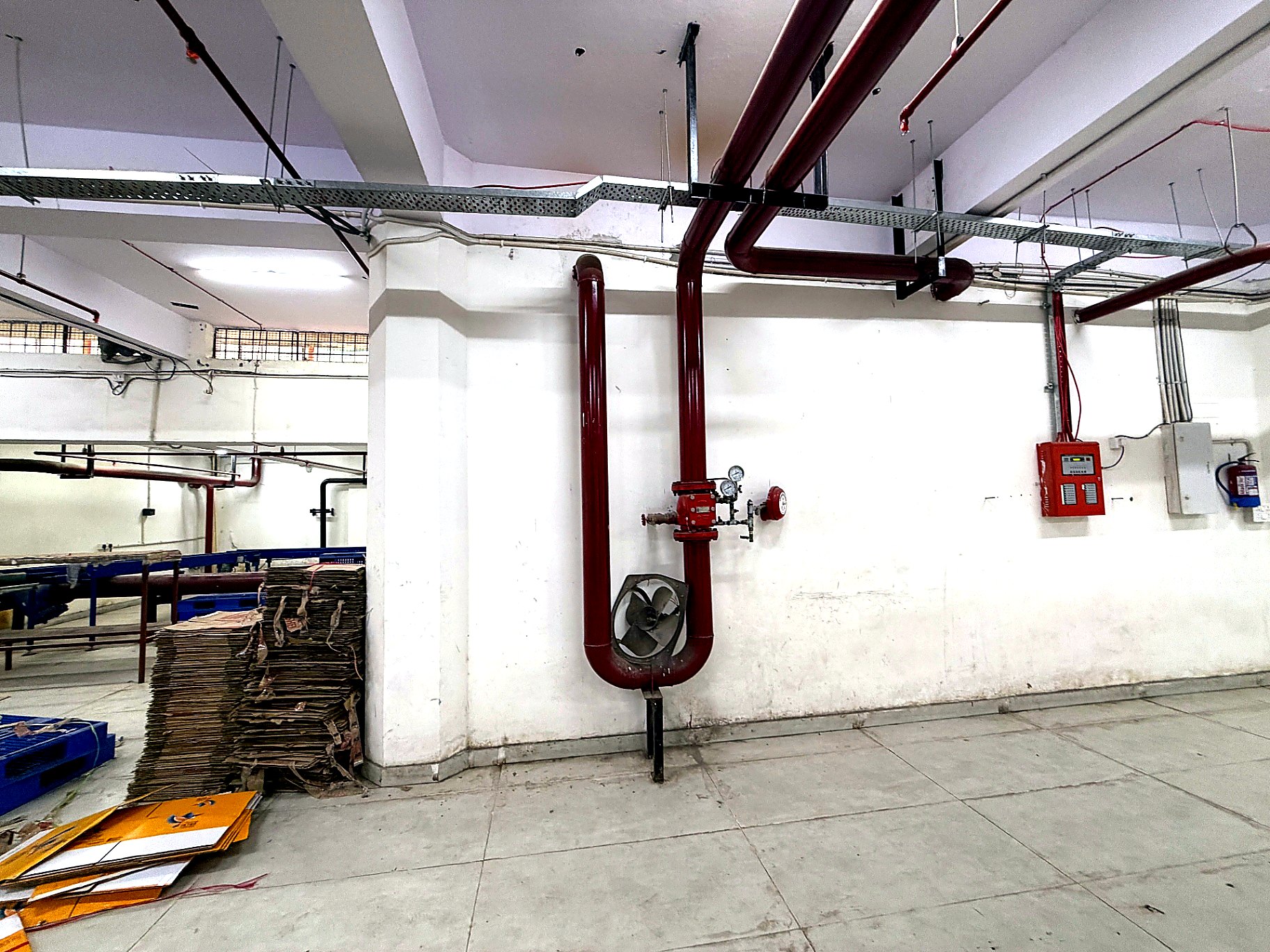Vertical riser with pressure gauge and alarm arrangement installed at the Okhla Phase-1 project by Decon Infratech