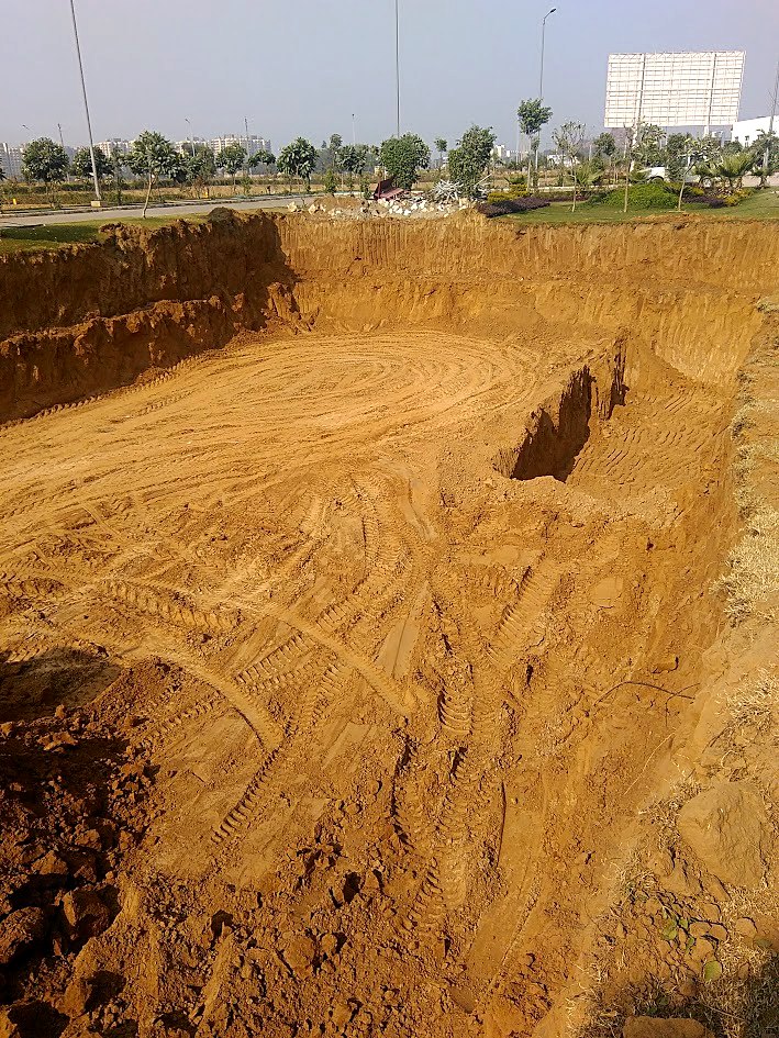 Completed and levelled excavation pit prepared for Sewage Treatment Plant tank construction at AMD Estates