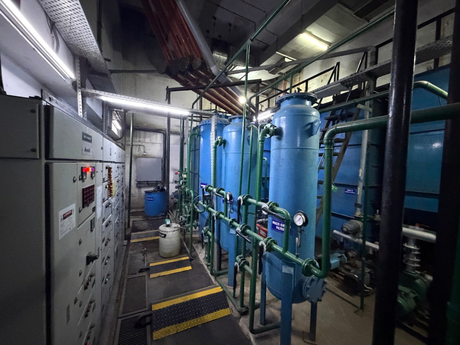 Treatment plant room at the Siemens facility in Noida with blue vessels, pumps, piping and control panels